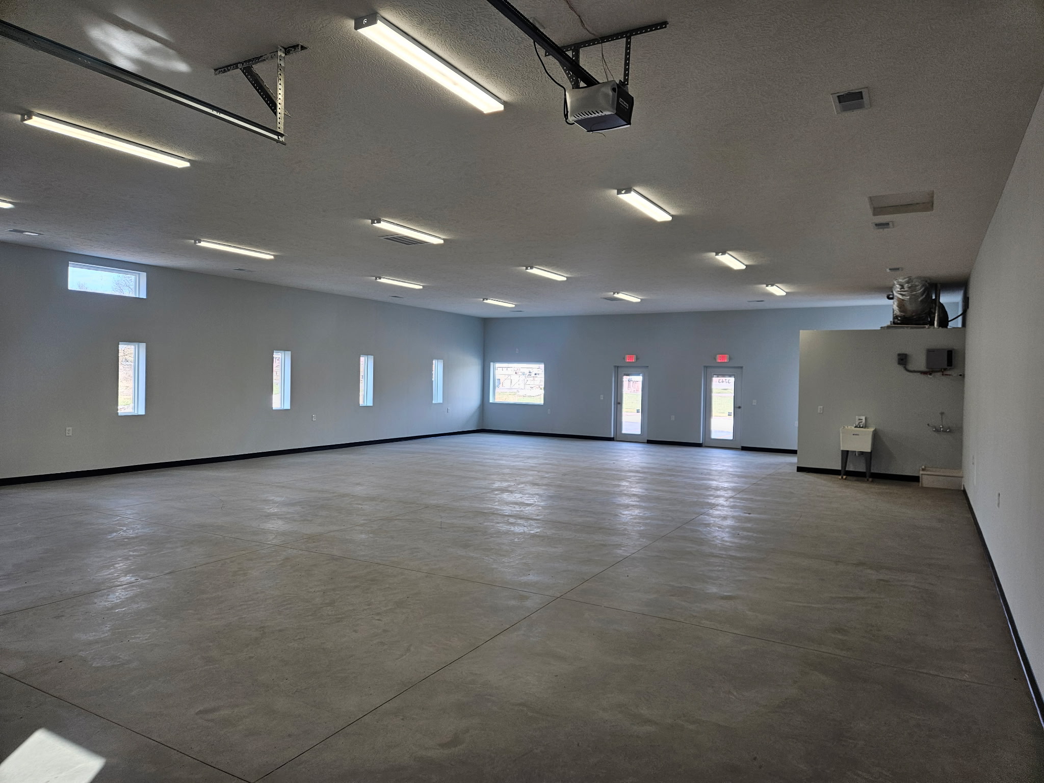 Front view of Buckeye Flex Space commercial suites with parking and store fronts